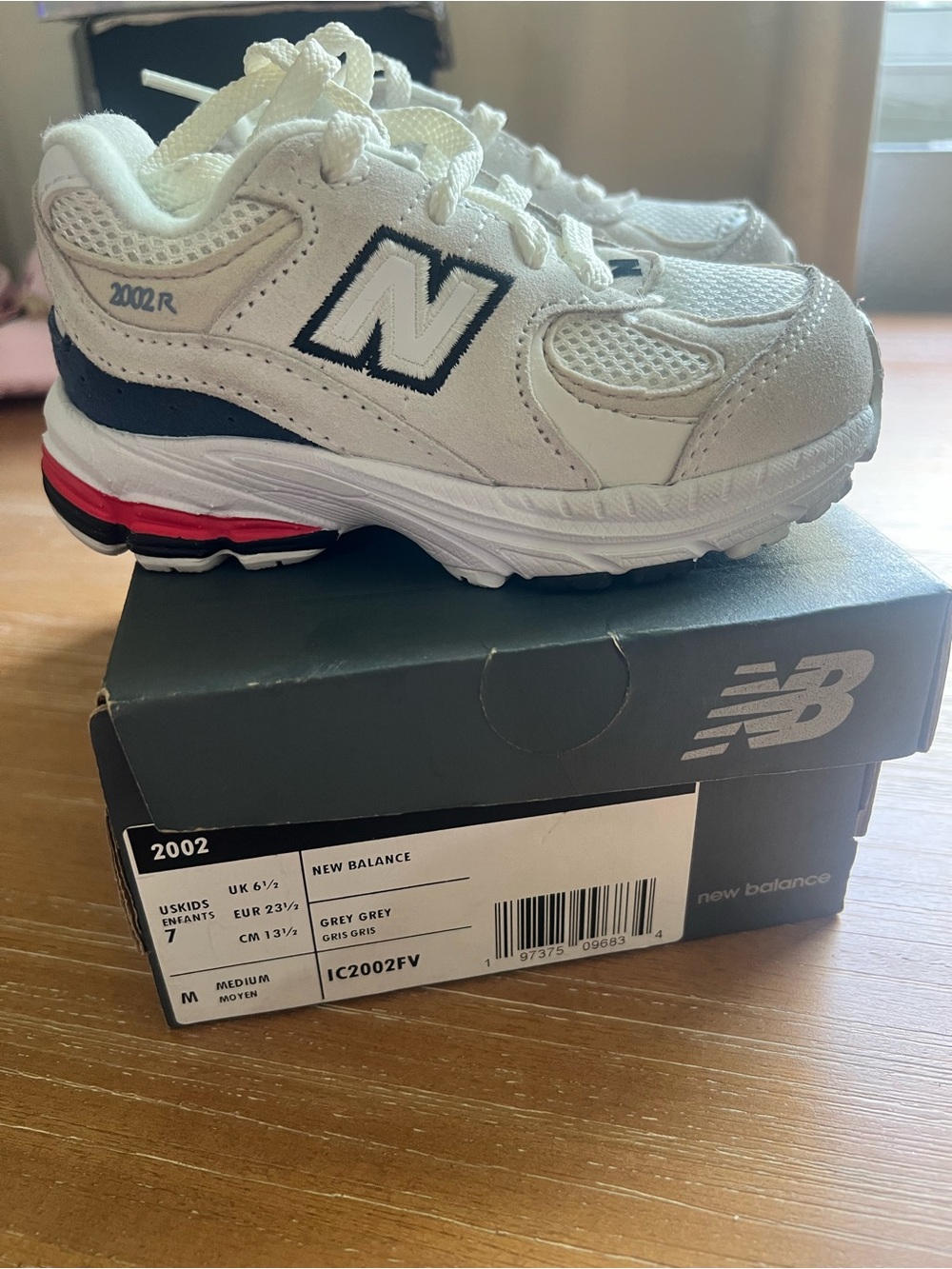 New Balance Kids 2002R Sneakers in White with Navy & Red Accents